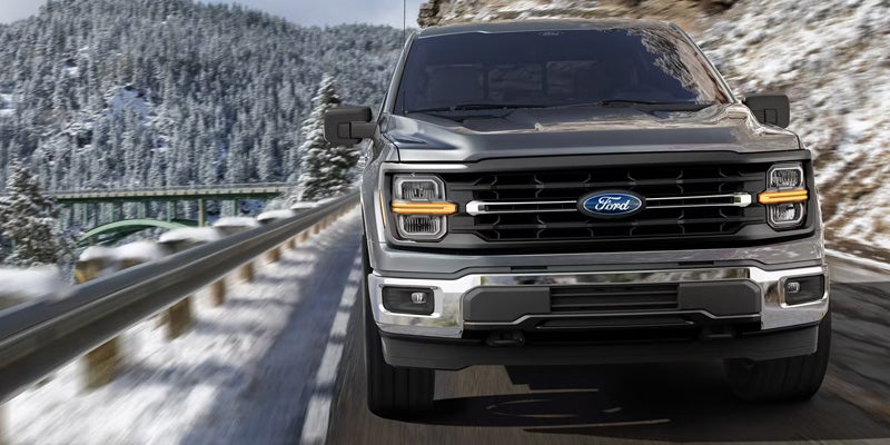 A split image showing a Ford in summer sun and winter snow in Lander.